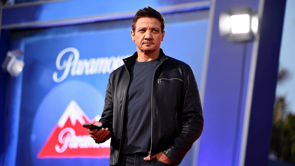 Jeremy Renner looks at something offscreen