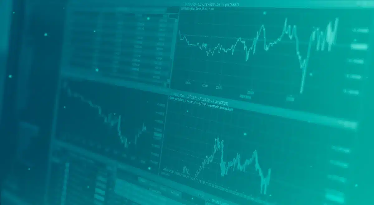 Écran montrant échanges de tokens et graphique de prix dans un bureau lumineux