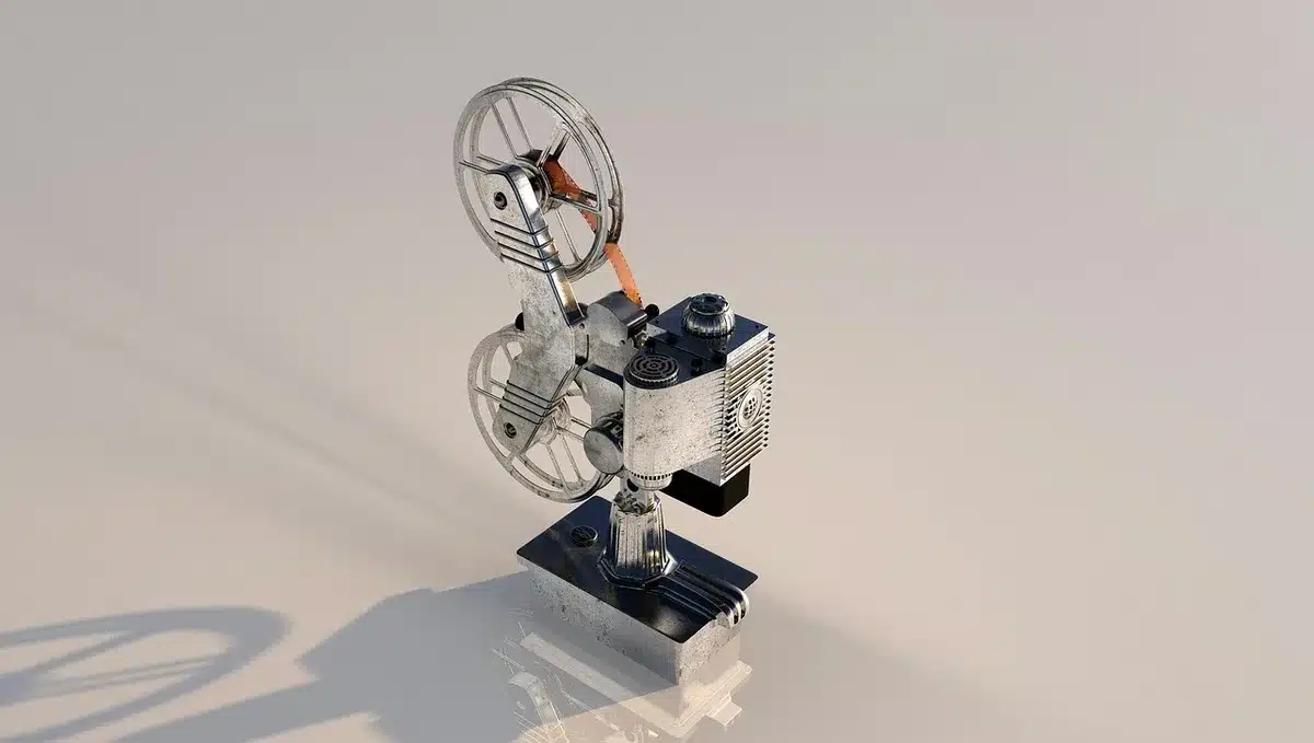 Compact white portable projector on a small table, anonymous living-room background, soft evening light
