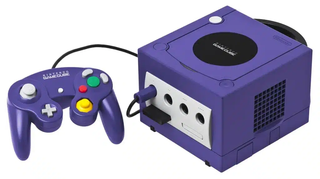 GuliKit TT Max : test et avis sur la manette haut de gamme pour Switch 2 Manette de jeu générique posée près d'une fenêtre, mains anonymes réglant un stick
