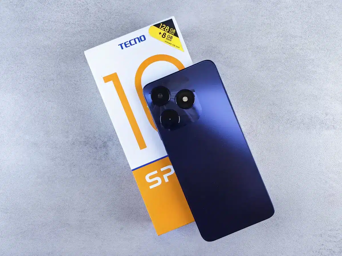 An anonymous close-up of a boxed, unbranded smartphone sitting on a plain table with a small price tag visible but unreadable, soft daylight through a window